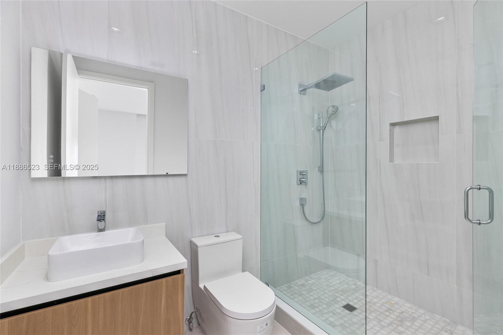 17301 Southwest 52nd Court Southwest Ranches, FL 33331 - Photo 33 of 47 a bathroom with a sink toilet and shower