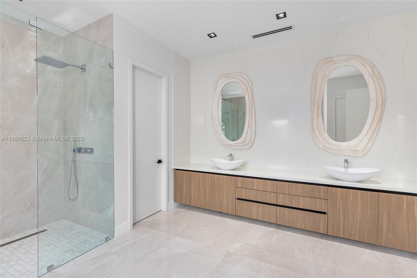 17301 Southwest 52nd Court Southwest Ranches, FL 33331 - Photo 37 of 47 a bathroom with a double vanity sink mirror and shower