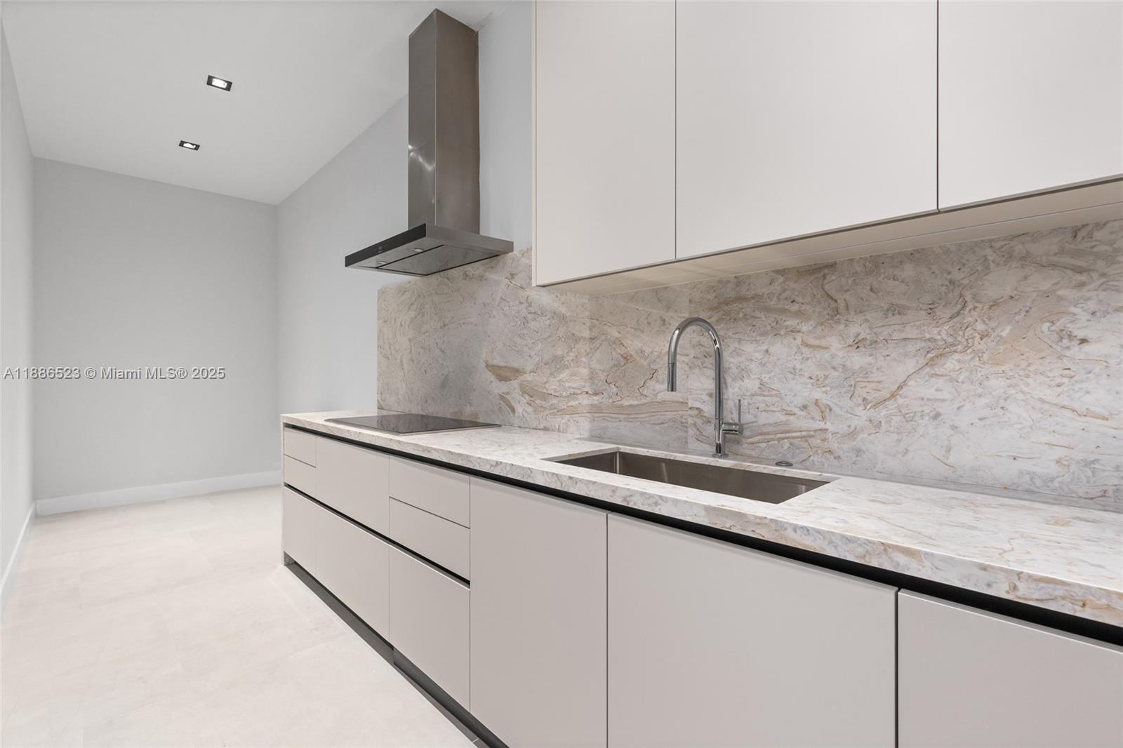17301 Southwest 52nd Court Southwest Ranches, FL 33331 - Photo 39 of 47 a kitchen with a sink and cabinets
