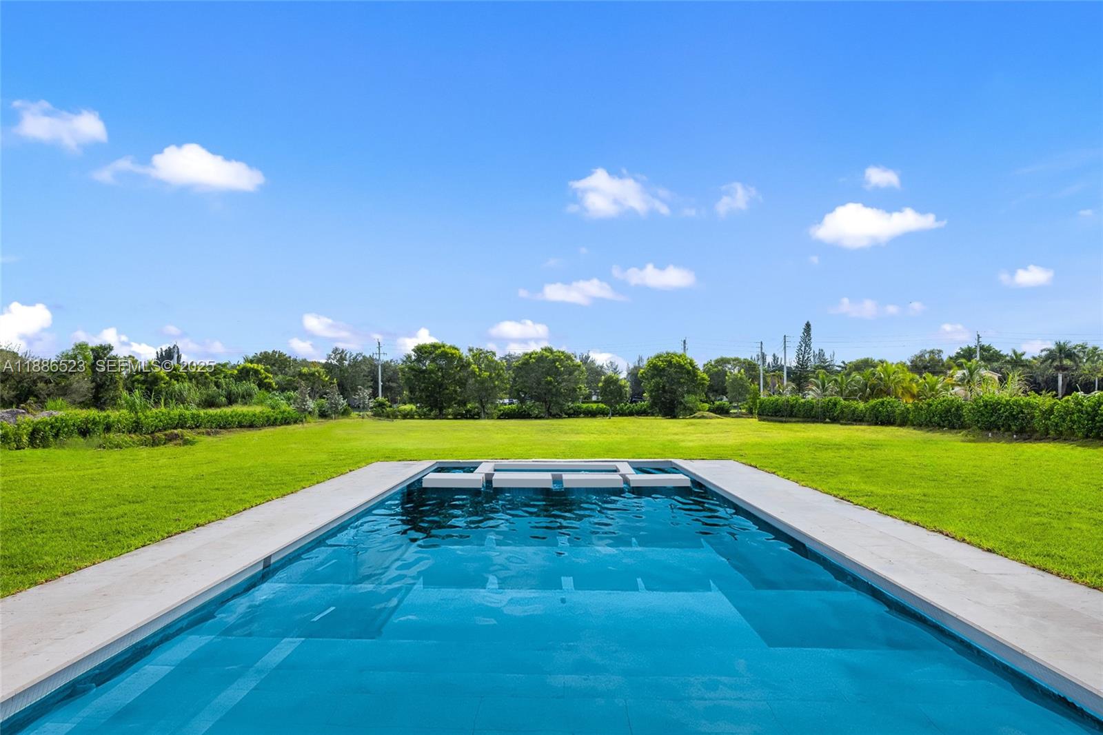 17301 Southwest 52nd Court Southwest Ranches, FL 33331 - Photo 44 of 47 a view of an outdoor space and swimming pool
