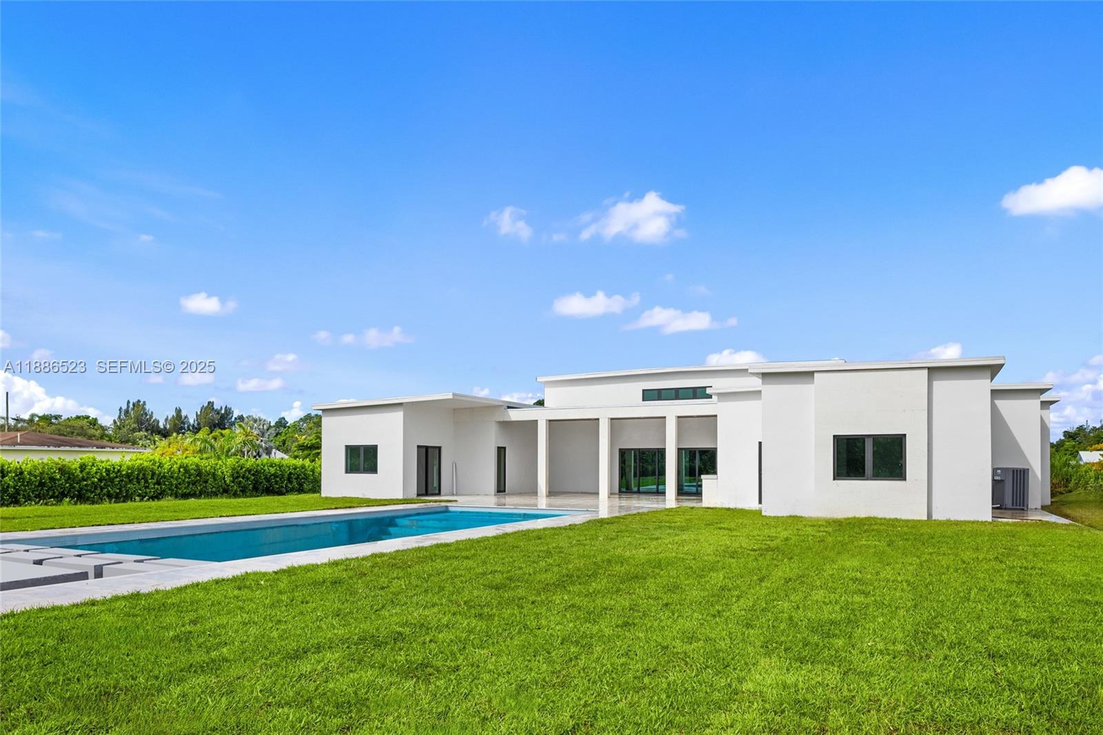 17301 Southwest 52nd Court Southwest Ranches, FL 33331 - Photo 46 of 47 a front view of a house with a yard