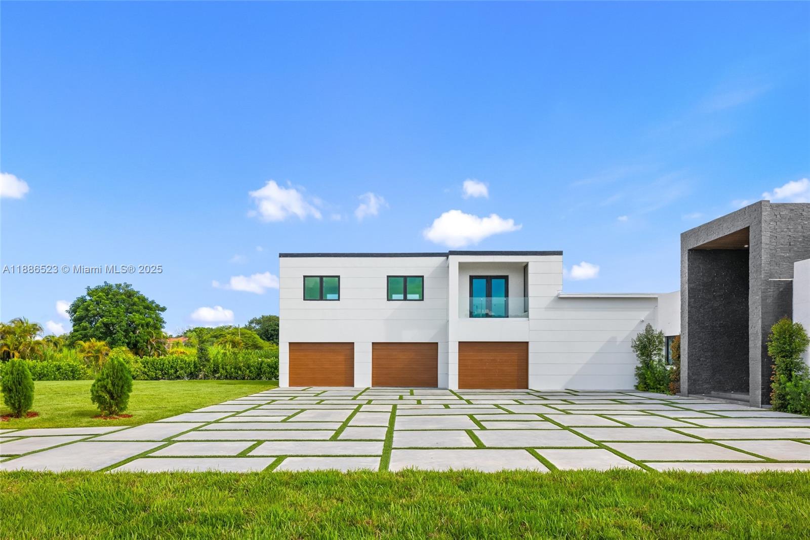 17301 Southwest 52nd Court Southwest Ranches, FL 33331 - Photo 8 of 47 a front view of a house with a yard
