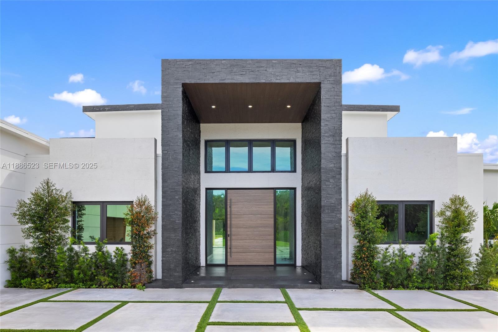 17301 Southwest 52nd Court Southwest Ranches, FL 33331 - Photo 10 of 47 a view of a brick house with a large window
