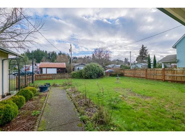 a kitchen with stainless steel appliances granite countertop a stove a refrigerator and a sink