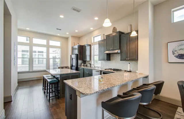 a kitchen with granite countertop lots of counter top space