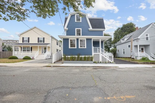 a front view of a house with a yard