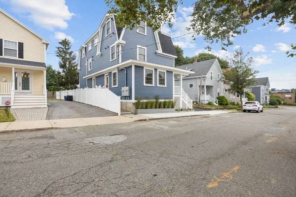 a view of a street in front of a house