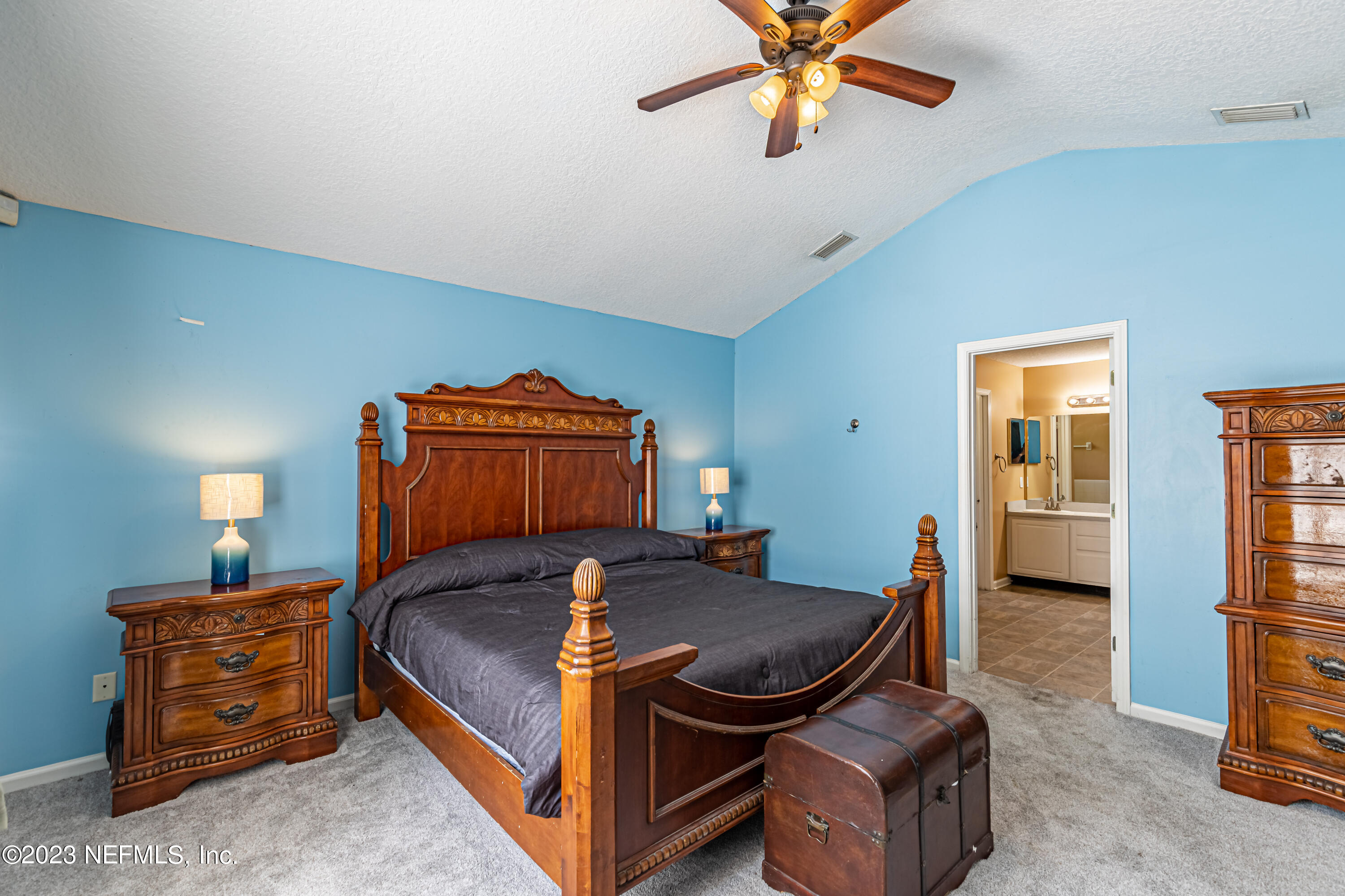1094 Cactus Cut Road Middleburg, FL 32068 - Photo 16 of 32 a bedroom with a bed and wooden floor