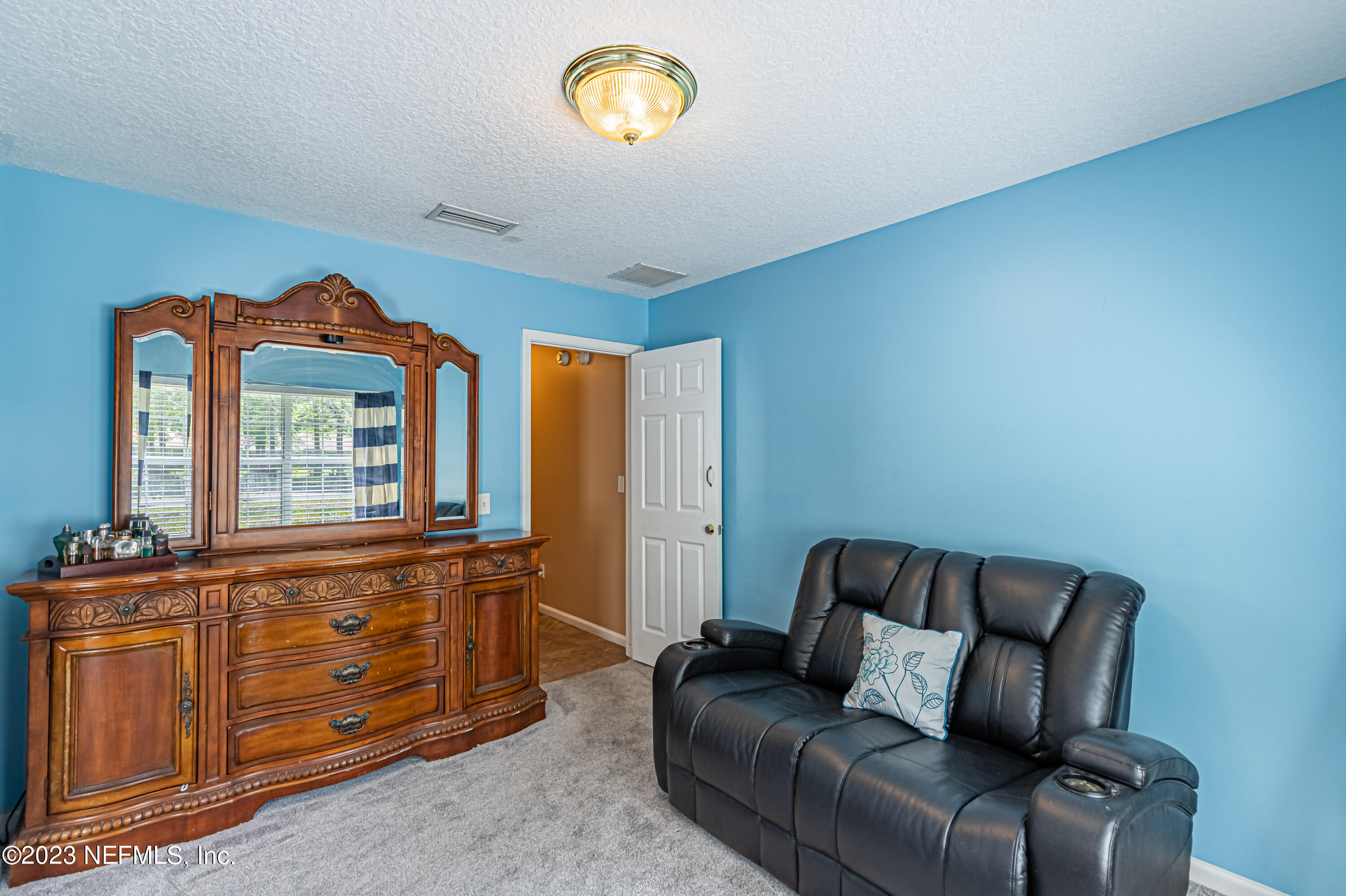 1094 Cactus Cut Road Middleburg, FL 32068 - Photo 18 of 32 a living room with furniture and a window