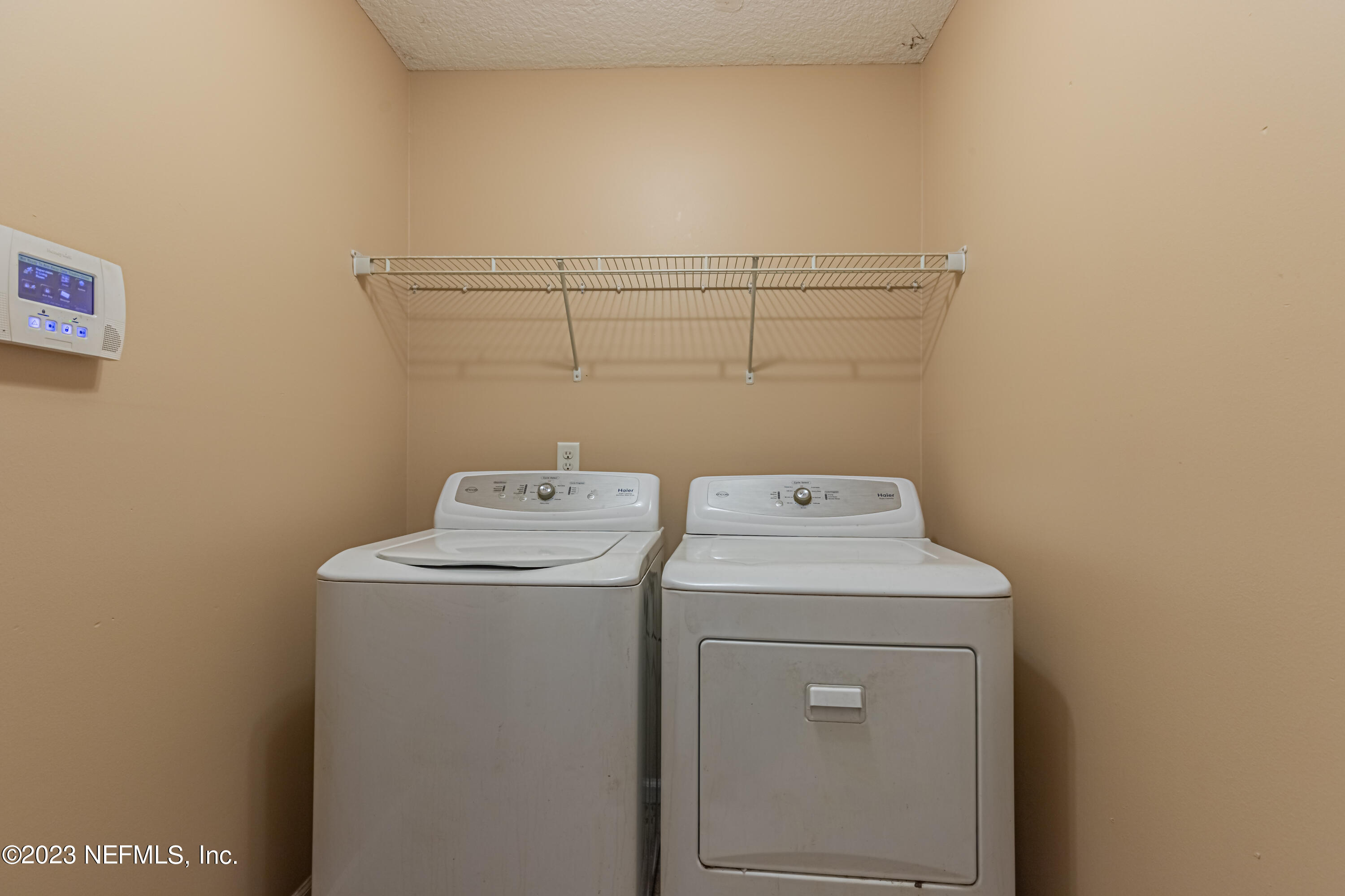 1094 Cactus Cut Road Middleburg, FL 32068 - Photo 25 of 32 a utility room with dryer and washer
