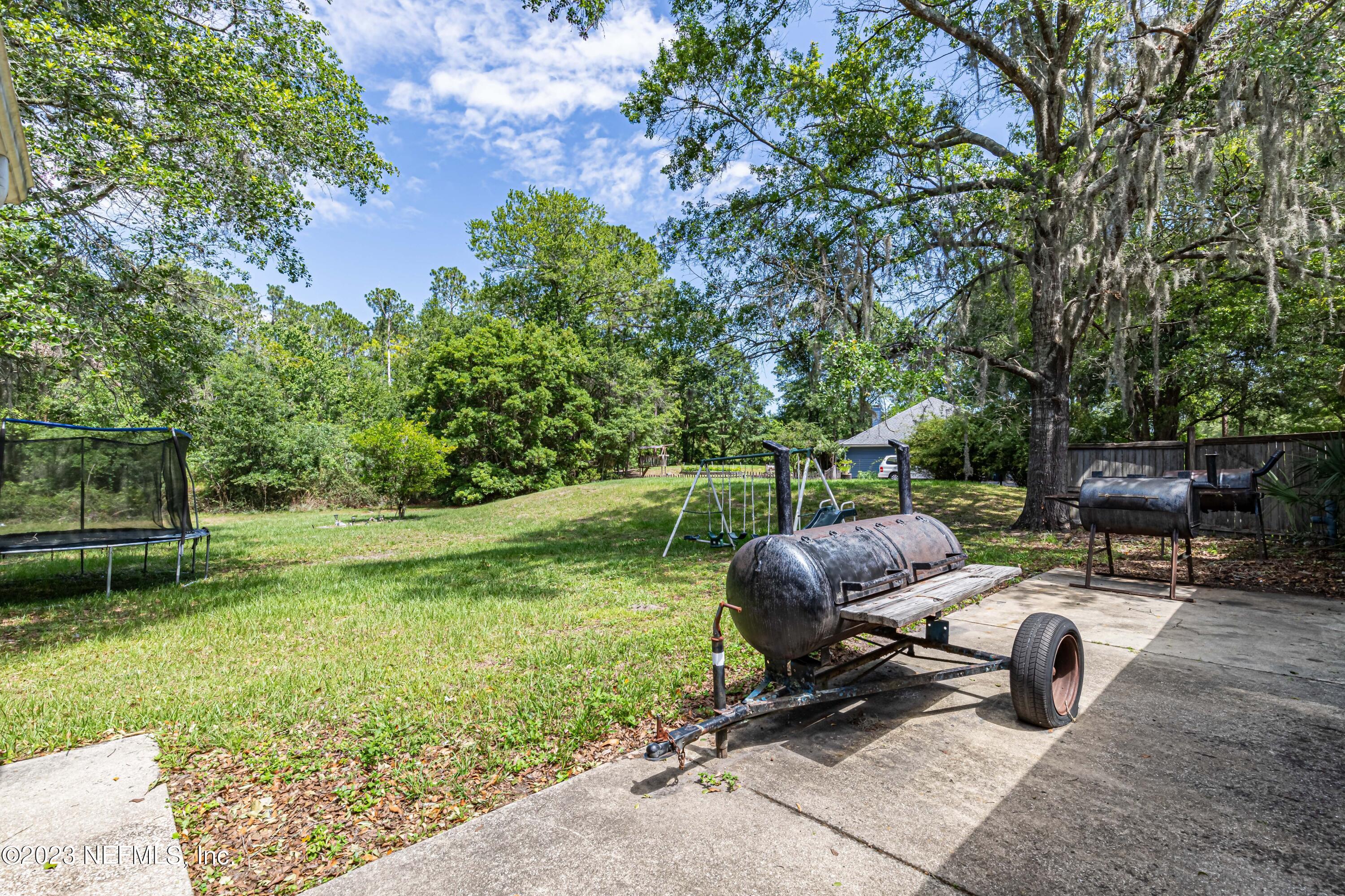 1094 Cactus Cut Road Middleburg, FL 32068 - Photo 29 of 32 a view of backyard with outdoor seating and green space