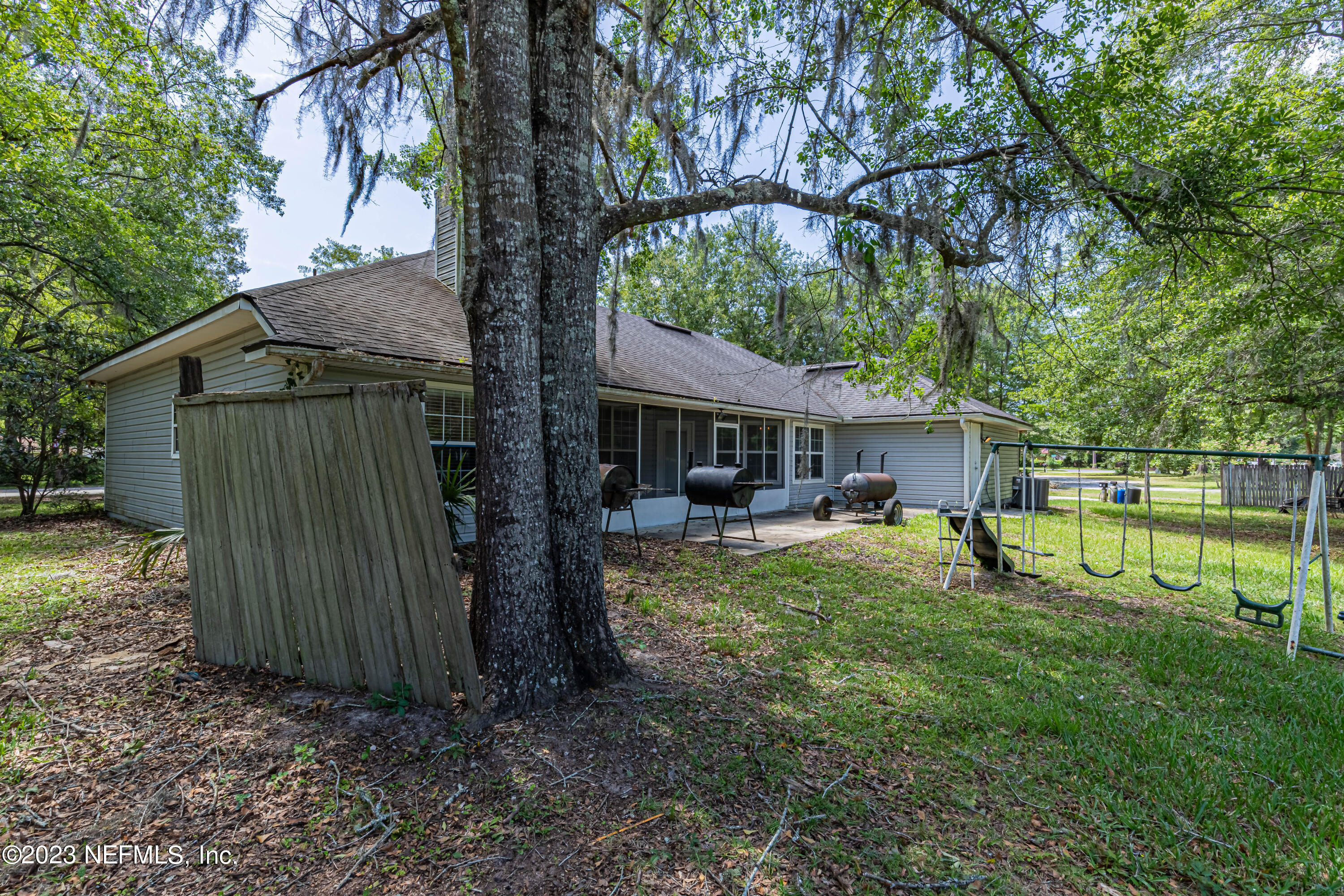 1094 Cactus Cut Road Middleburg, FL 32068 - Photo 31 of 32 a view of a house with backyard and a tree