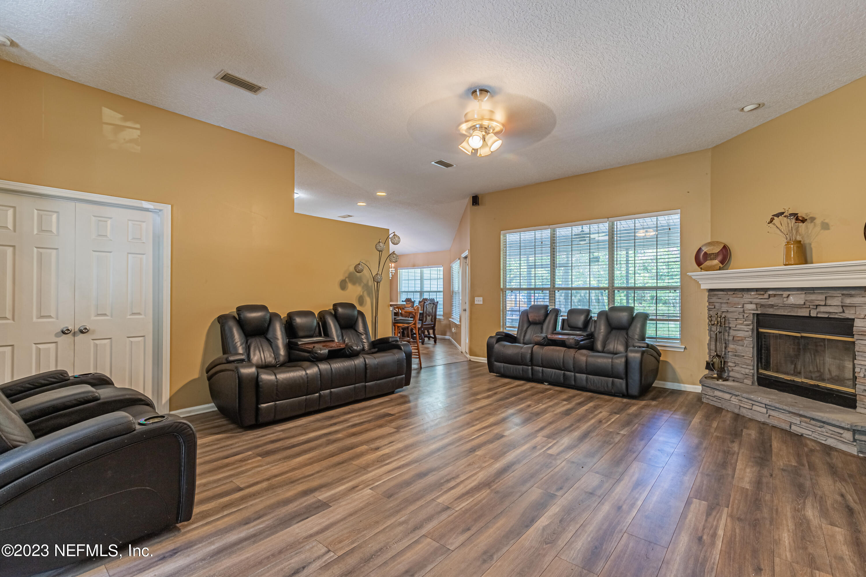 1094 Cactus Cut Road Middleburg, FL 32068 - Photo 7 of 32 a living room with furniture and a fireplace