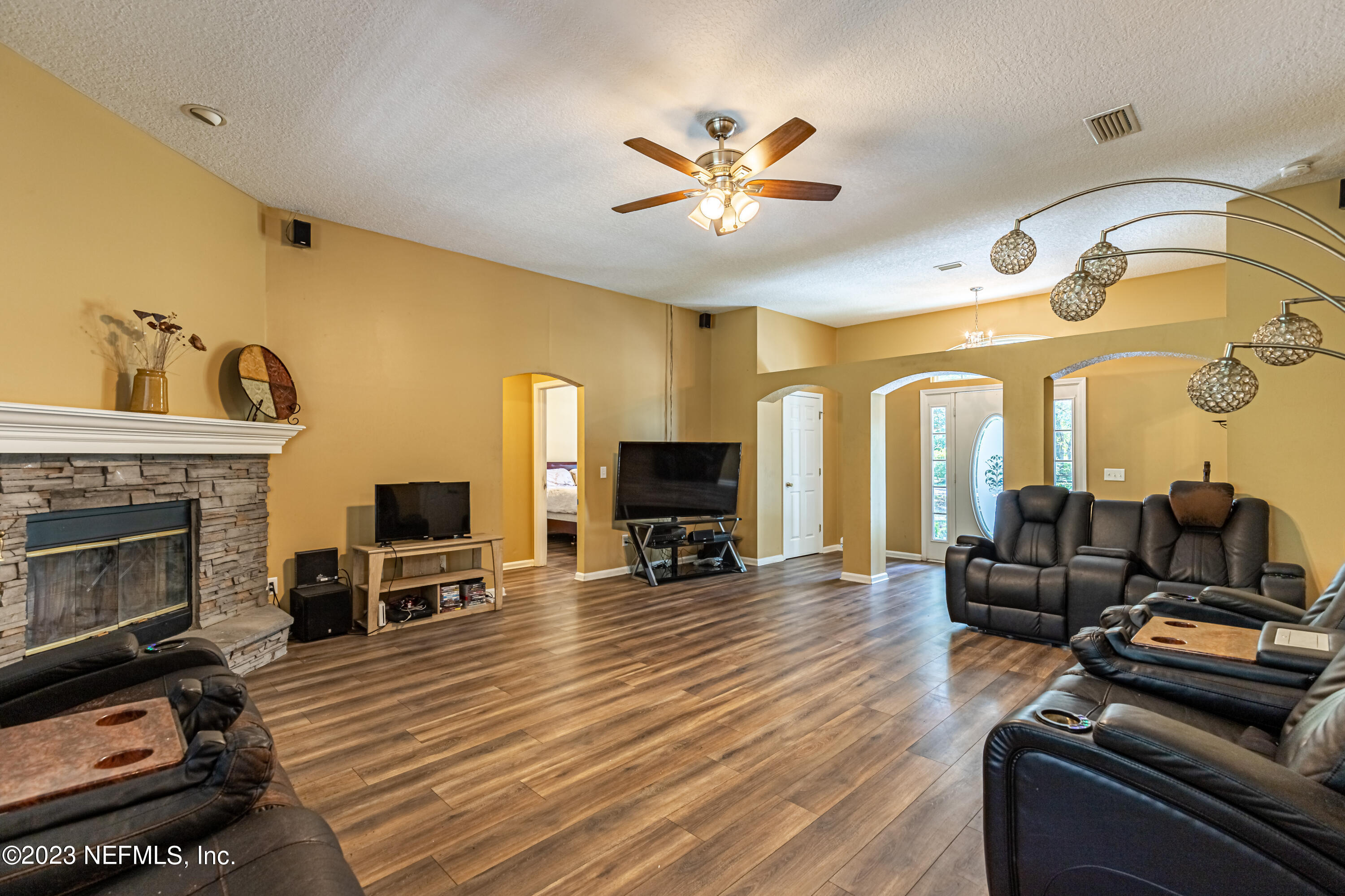 1094 Cactus Cut Road Middleburg, FL 32068 - Photo 8 of 32 a living room with furniture and a fireplace