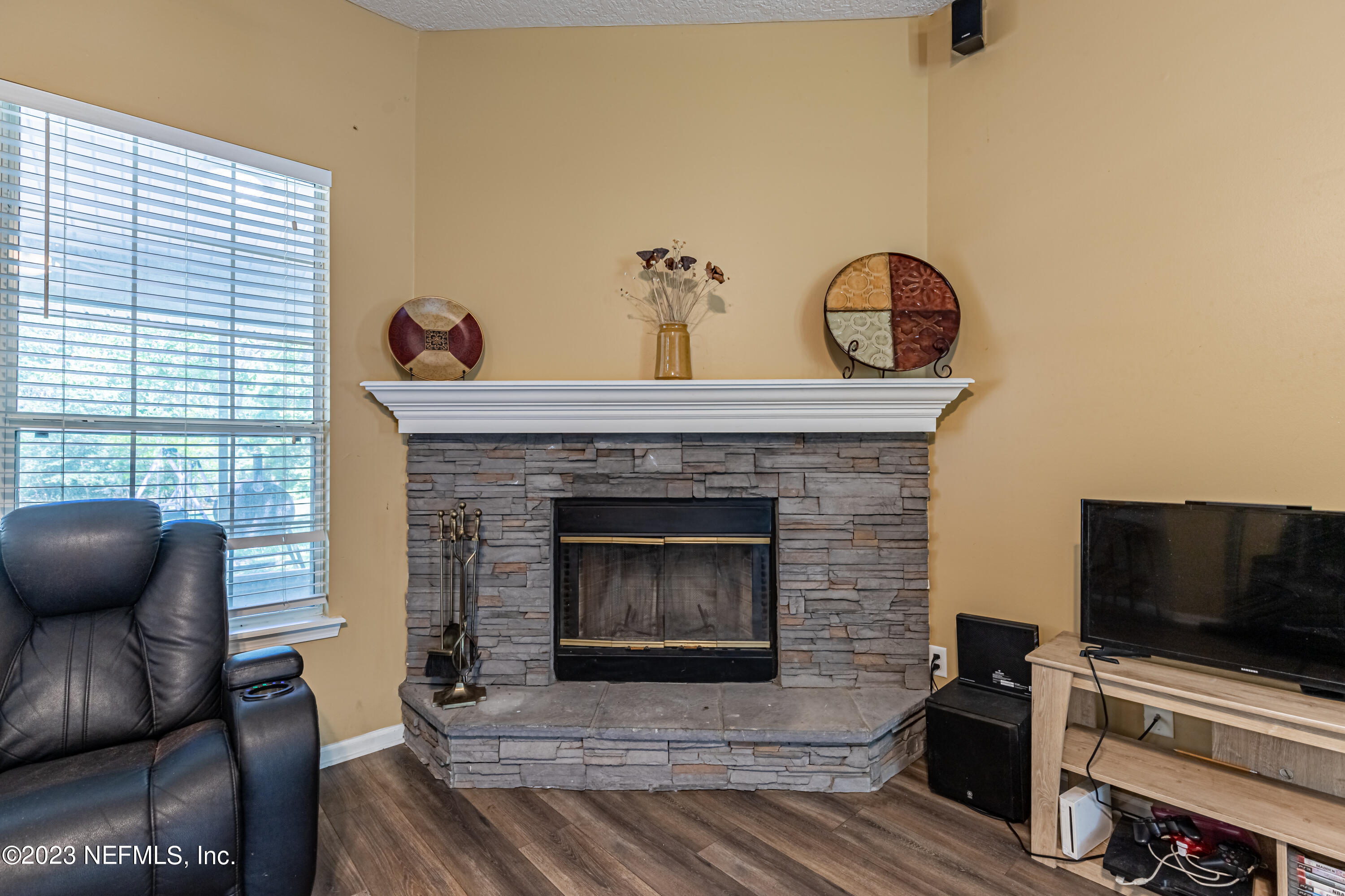 1094 Cactus Cut Road Middleburg, FL 32068 - Photo 9 of 32 a living room with furniture and a fireplace