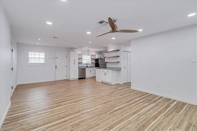 a view of a kitchen with a dishwasher and a refrigerator