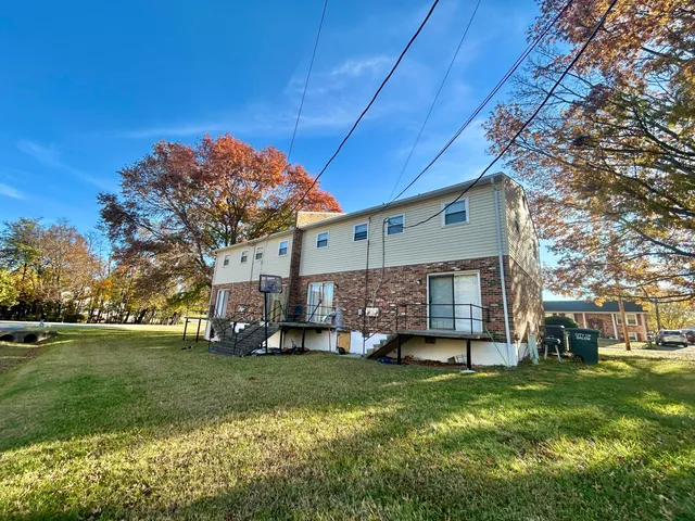 a view of a house with a back yard