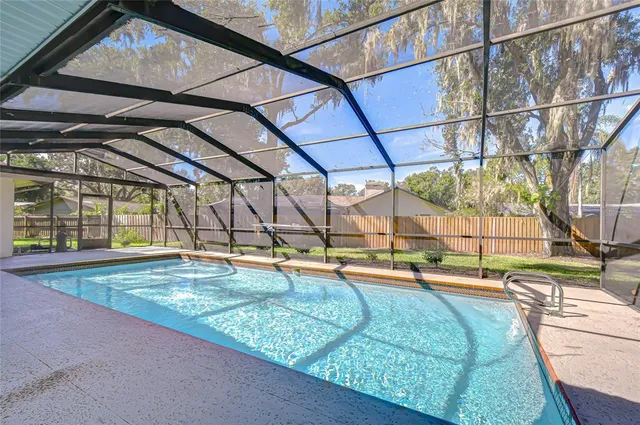 a view of swimming pool with a patio
