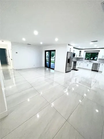 a view of a livingroom with table and chair