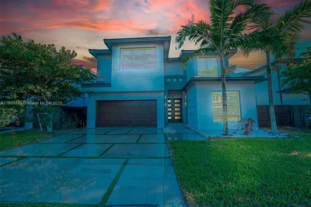 a front view of a house with a garden