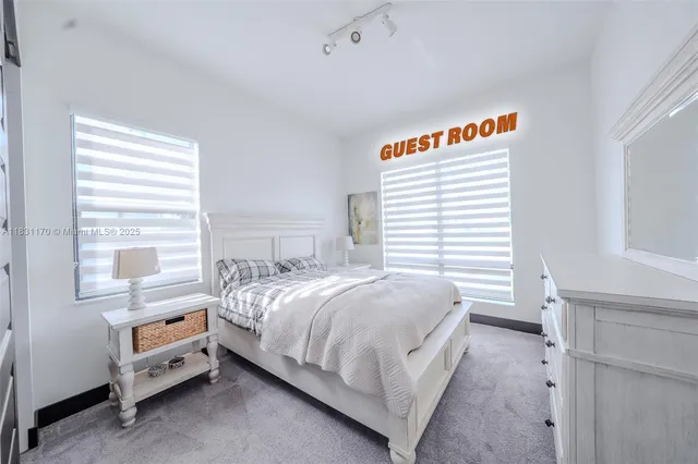 a bed room with a bed and a window