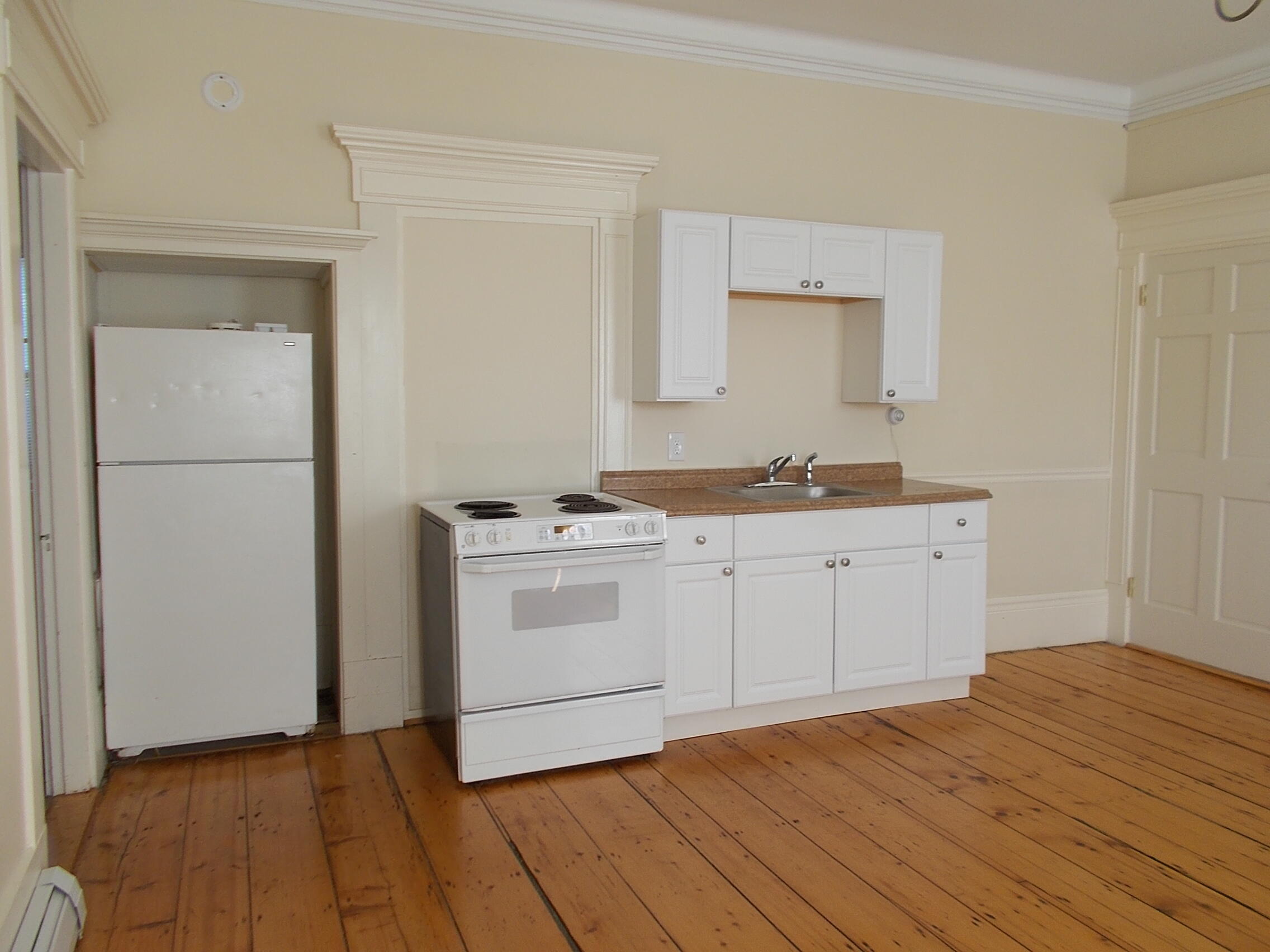 a room with a sink and a mirror