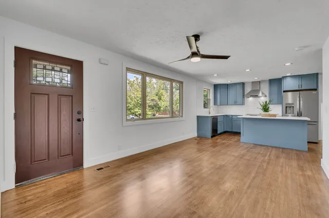 a view of kitchen with wooden floor and window