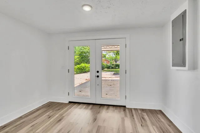 a view of room with window and hallway