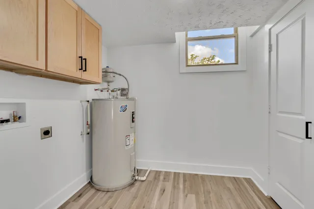 a view of hallway with wooden floor