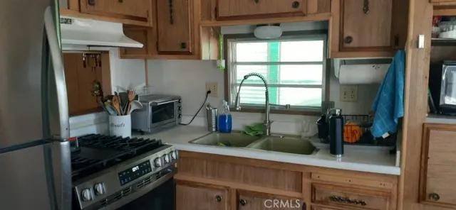 a view of a closet area with wooden floor