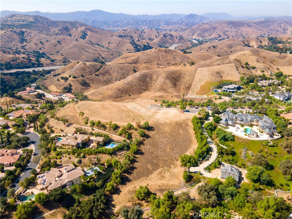 0 Walker Road Hidden Hills, CA 91302 - Photo 1 of 1 an aerial view of residential house with yard and mountain view