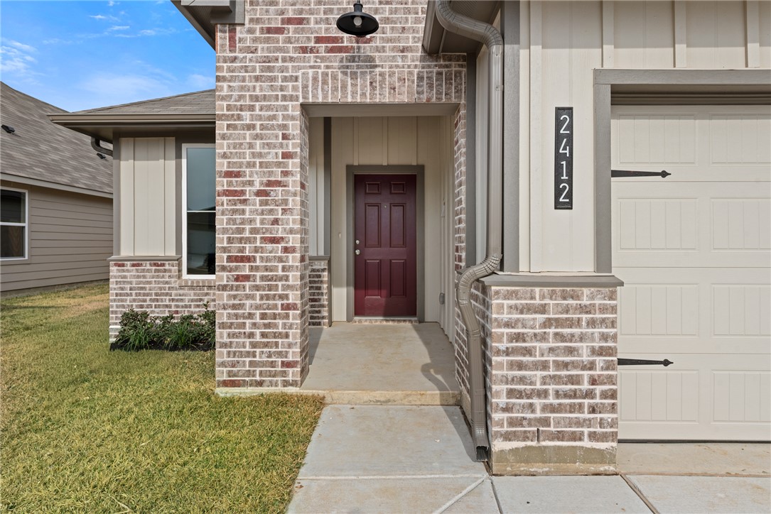 2412 Rooke Road Bryan, TX 77807 - Photo 4 of 35 a front view of a house with a garden