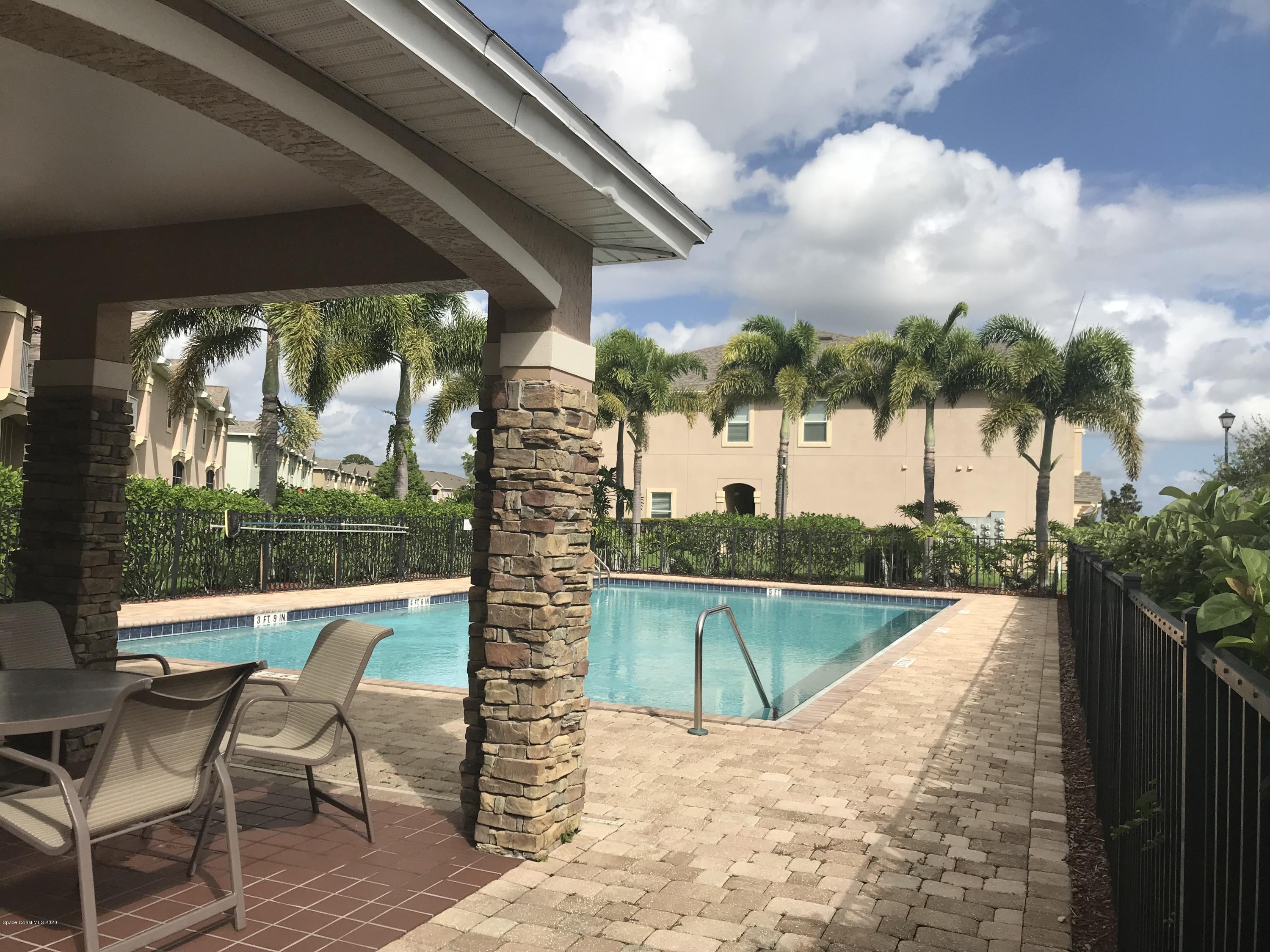 4127 Meander Place, Unit 203 Rockledge, FL 32955 - Photo 12 of 13 a view of a swimming pool with a patio
