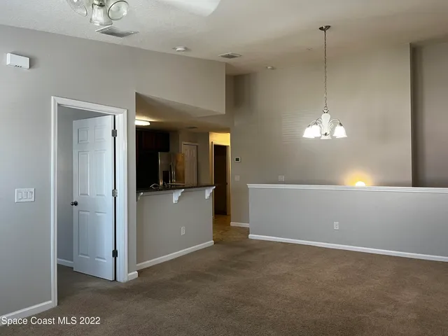 a view of a room with a hallway