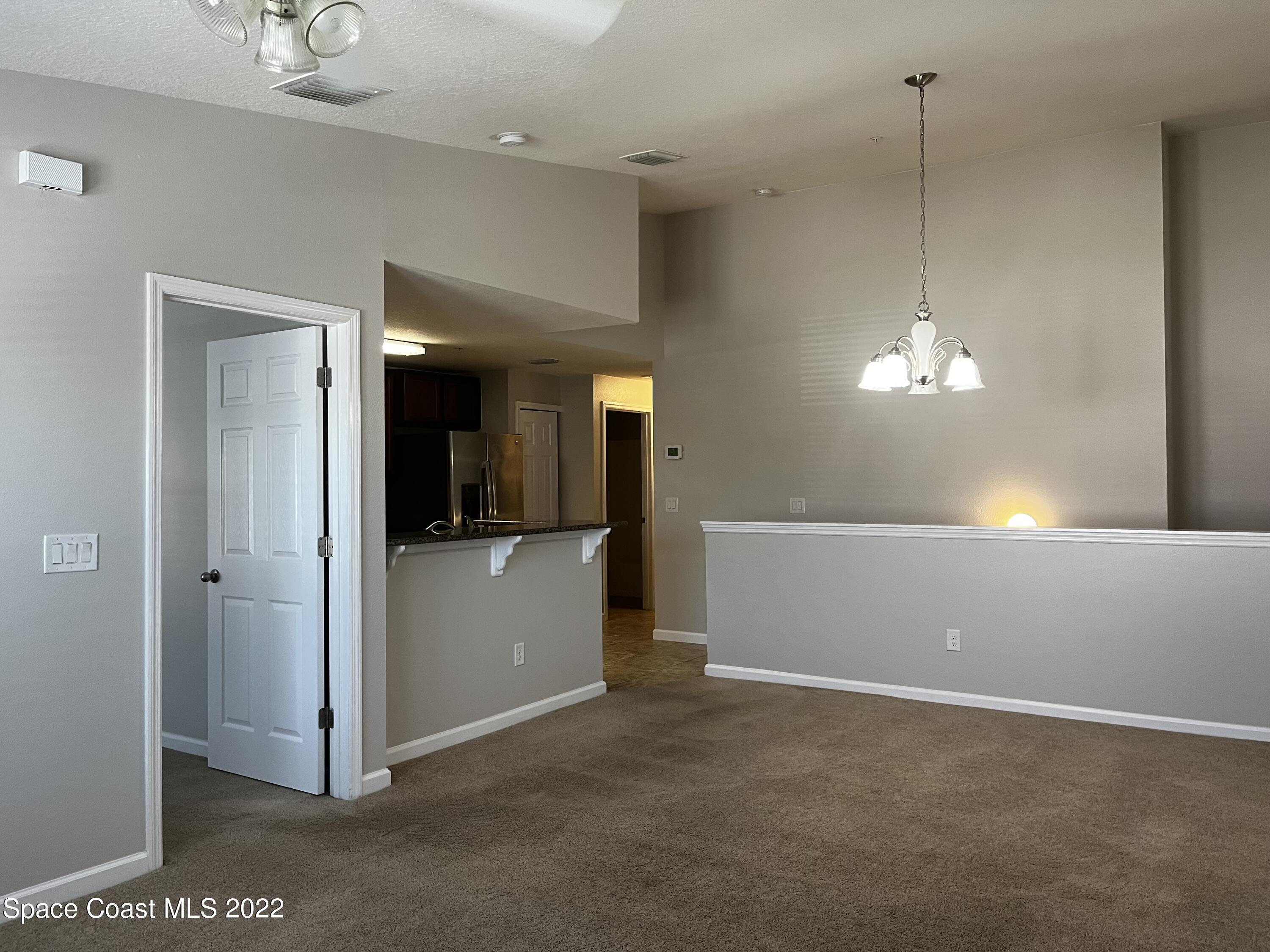 4127 Meander Place, Unit 203 Rockledge, FL 32955 - Photo 9 of 13 a view of a room with a hallway