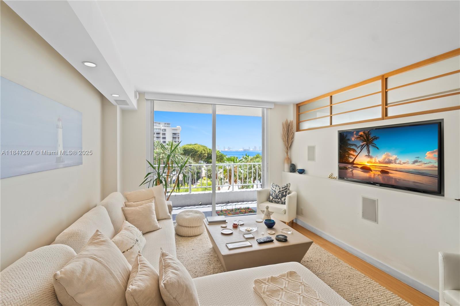 Brickell Miami, FL 33129 - Photo 6 of 42 a living room with furniture a window and a flat screen tv
