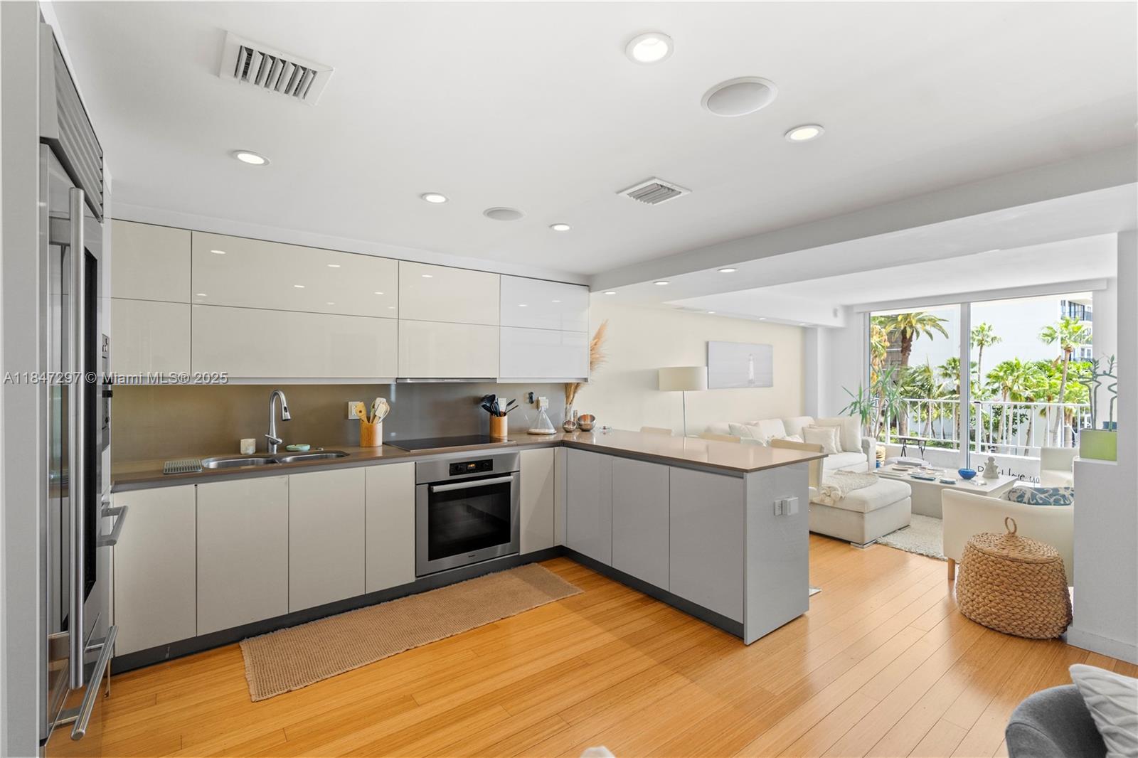 Brickell Miami, FL 33129 - Photo 9 of 42 a kitchen with stainless steel appliances granite countertop a sink and cabinets