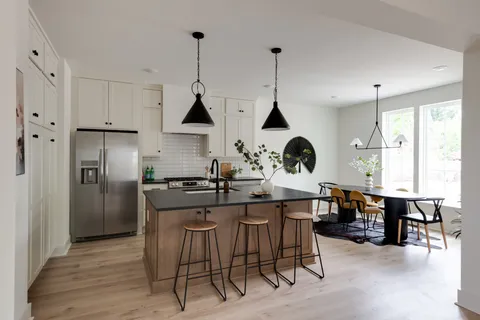 a kitchen with granite countertop a stove and a sink