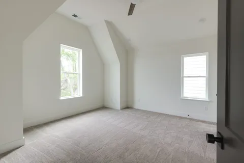 a spacious bathroom with a bathtub and window