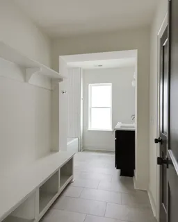 a bathroom with a tub sink and mirror