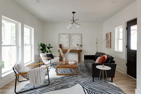 a living room with furniture and a window