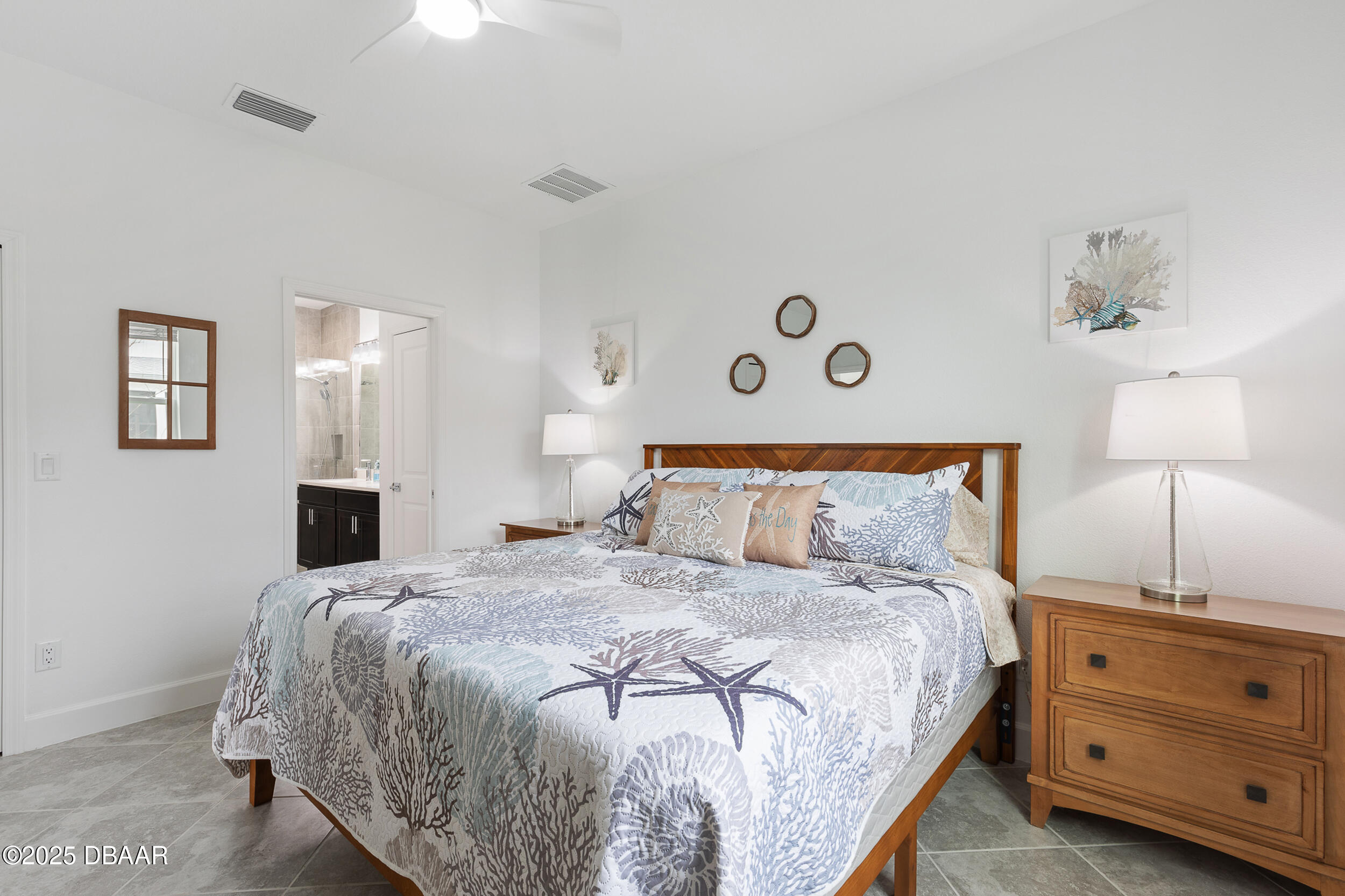 208 Ocean Hammock Loop Daytona Beach, FL 32124 - Photo 17 of 91 a bedroom with a bed and a night stand