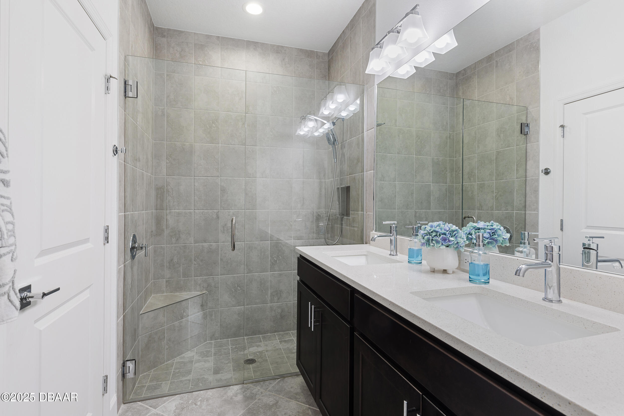 208 Ocean Hammock Loop Daytona Beach, FL 32124 - Photo 19 of 91 a bathroom with a sink shower and a mirror