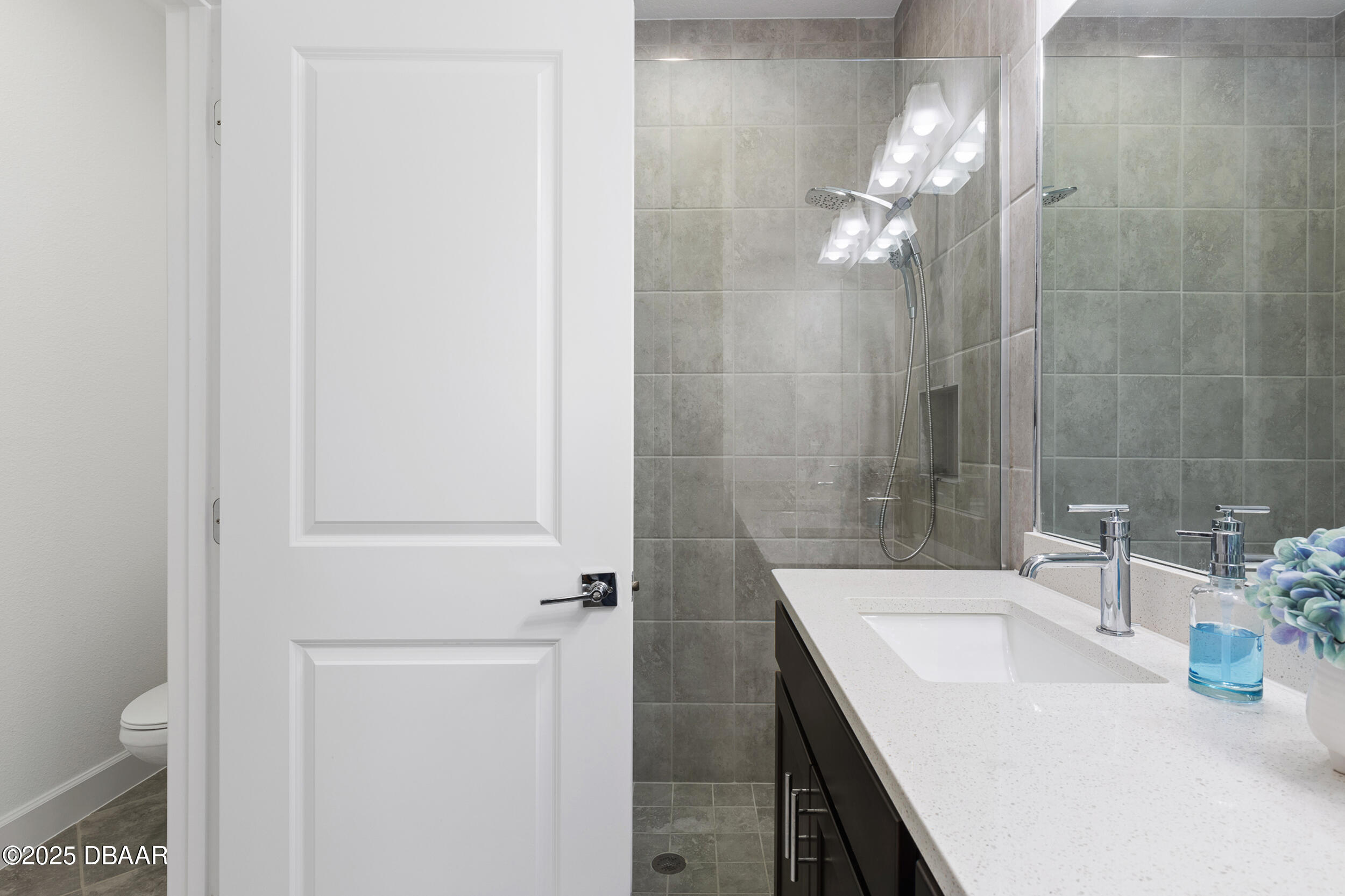 208 Ocean Hammock Loop Daytona Beach, FL 32124 - Photo 20 of 91 a bathroom with a sink a toilet and shower