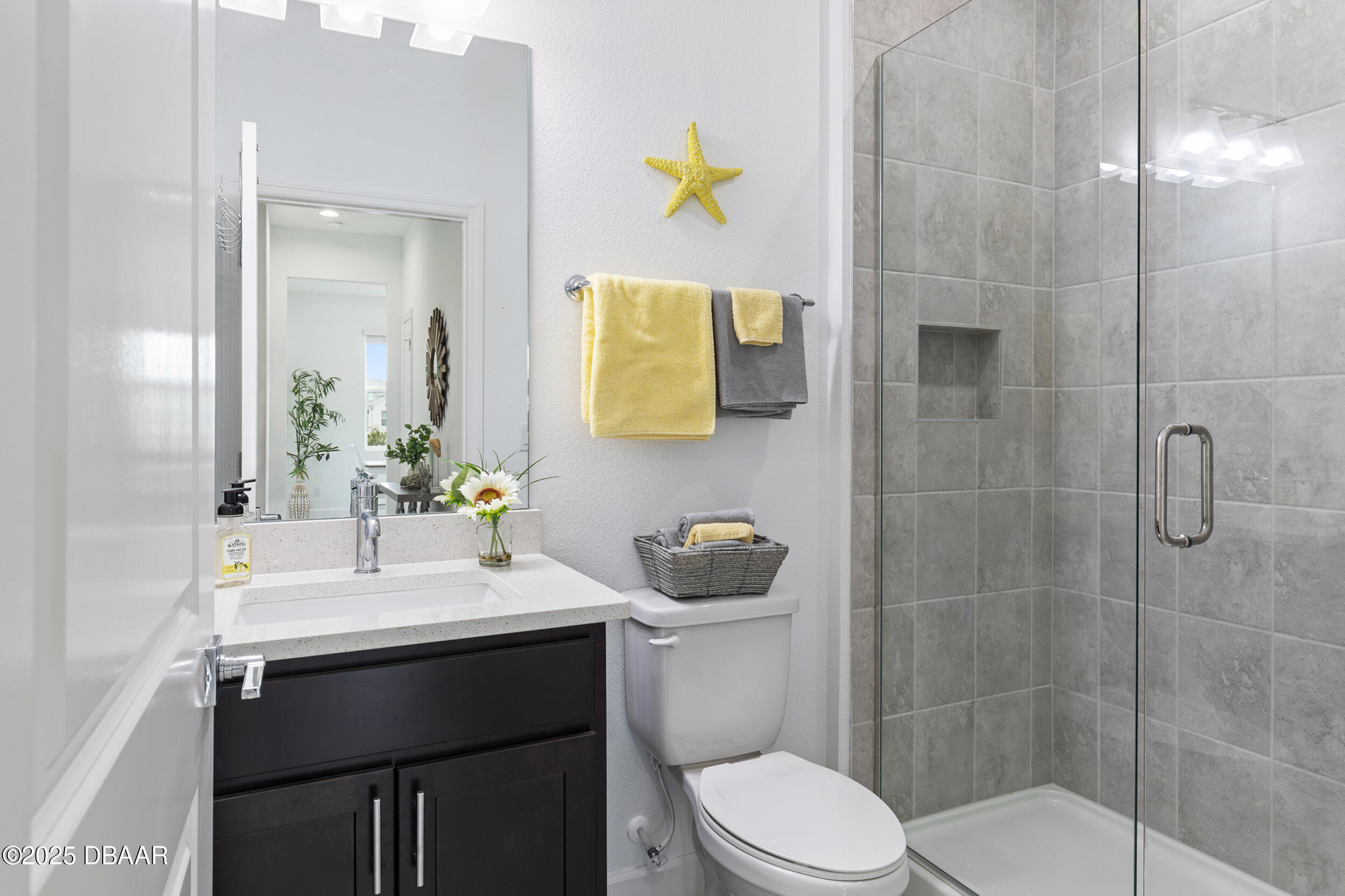 208 Ocean Hammock Loop Daytona Beach, FL 32124 - Photo 29 of 91 a bathroom with a sink mirror toilet and shower