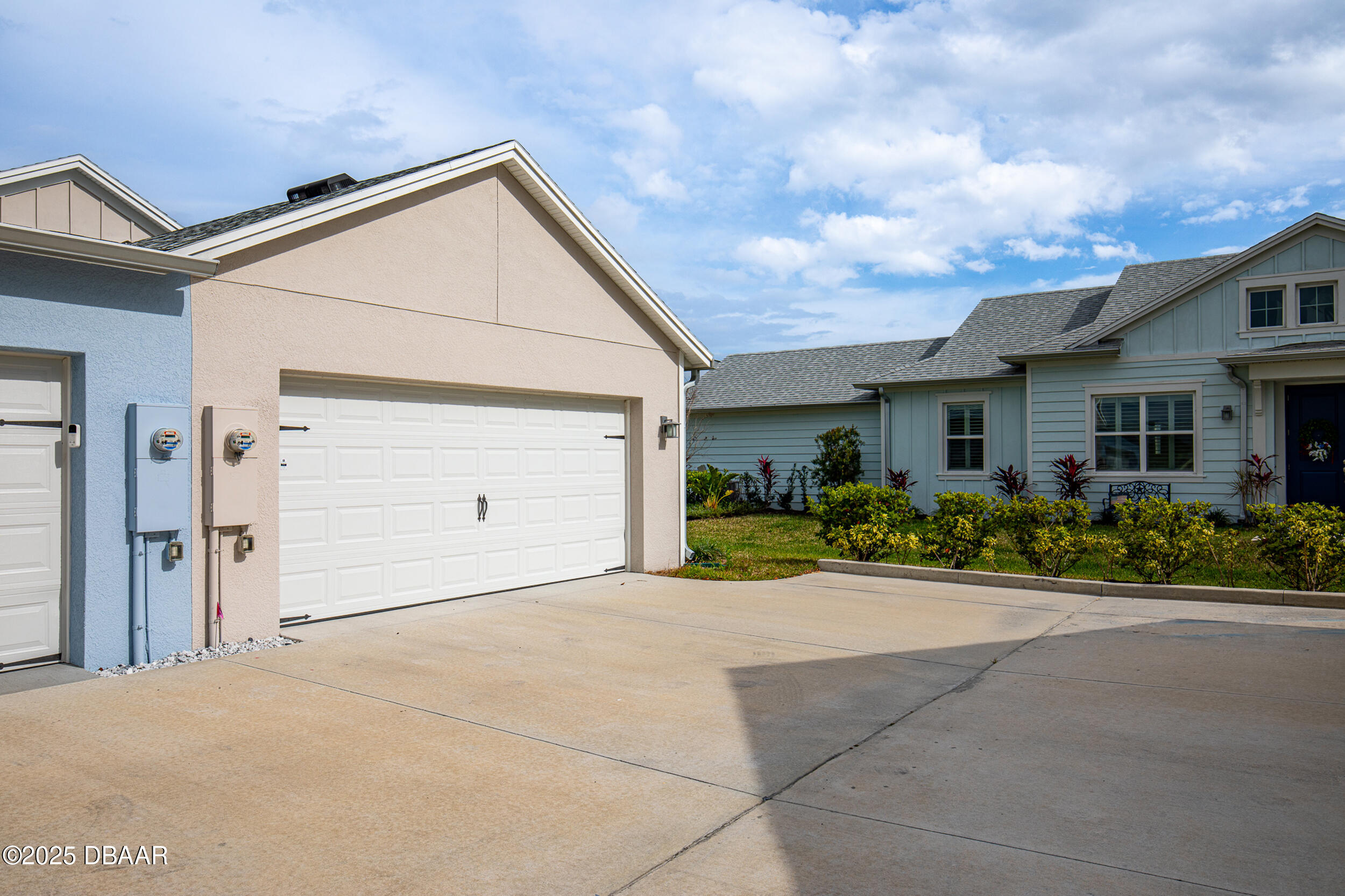 208 Ocean Hammock Loop Daytona Beach, FL 32124 - Photo 36 of 91 a front view of a house with yard and a garage