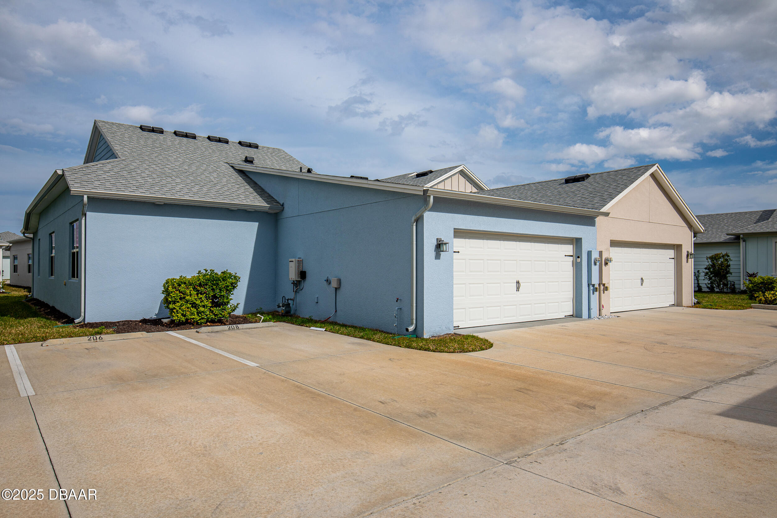 208 Ocean Hammock Loop Daytona Beach, FL 32124 - Photo 37 of 91 a view of a house with a yard and garage