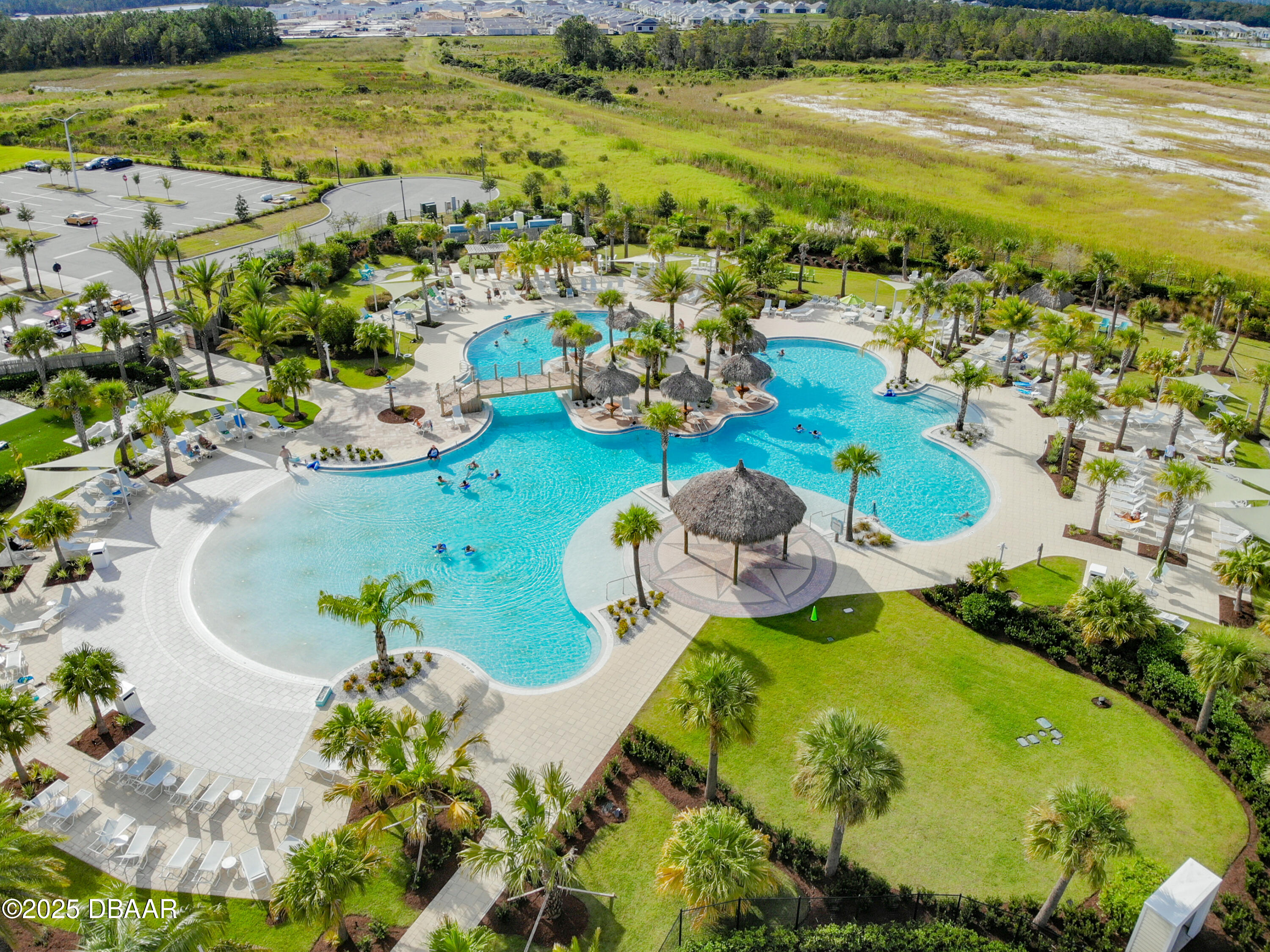 208 Ocean Hammock Loop Daytona Beach, FL 32124 - Photo 73 of 91 a view of a swimming pool with a table and chairs