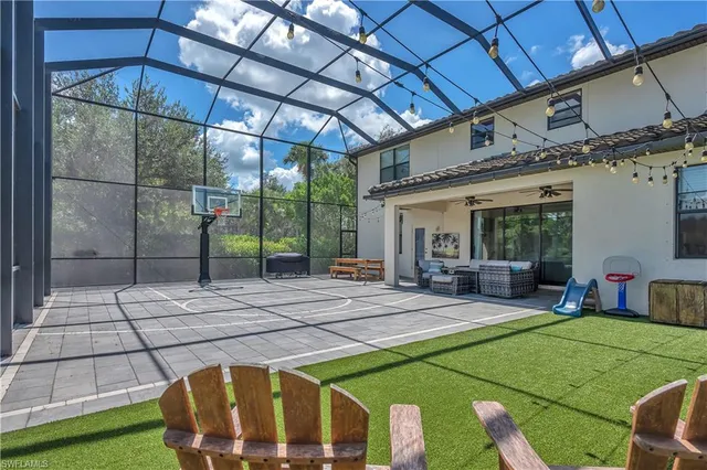 a view of a patio with table and chairs a barbeque with wooden fence