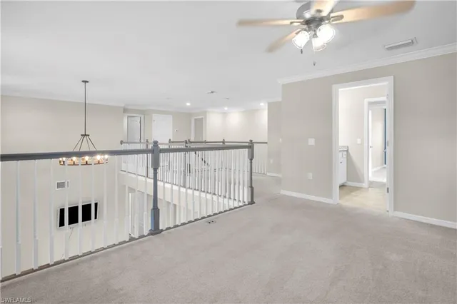 a view of a kitchen with a ceiling fan